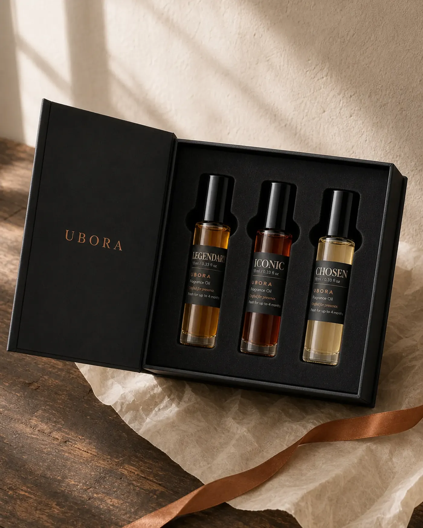 Three UBORA fragrance oils in an open presentation box