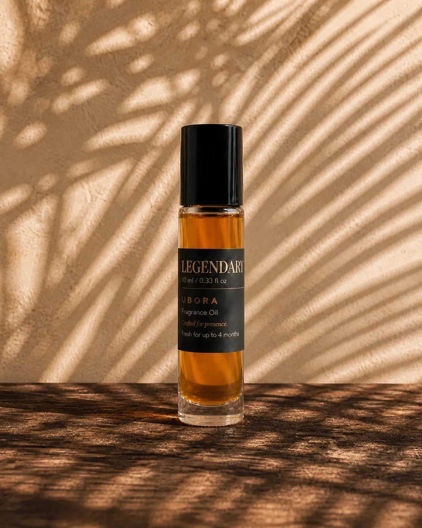 UBORA Legendary fragrance oil glowing in midday light